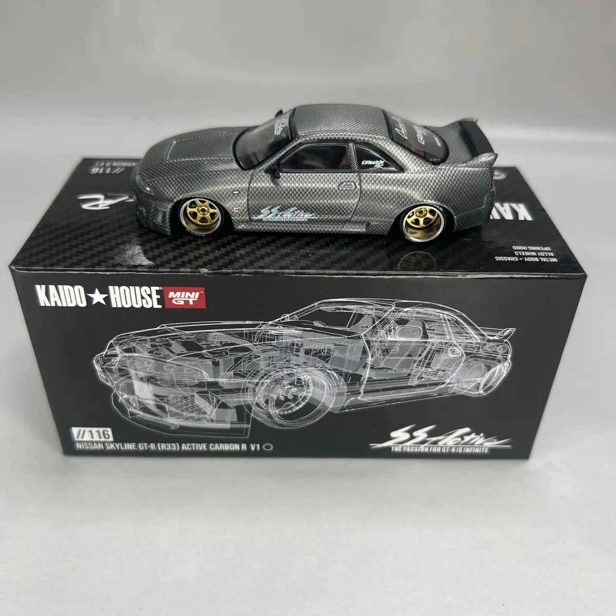 Chase Kaido House X Mini Gt 1:64 #116 Nissan Gt-R (R33) Active Carbon R 1