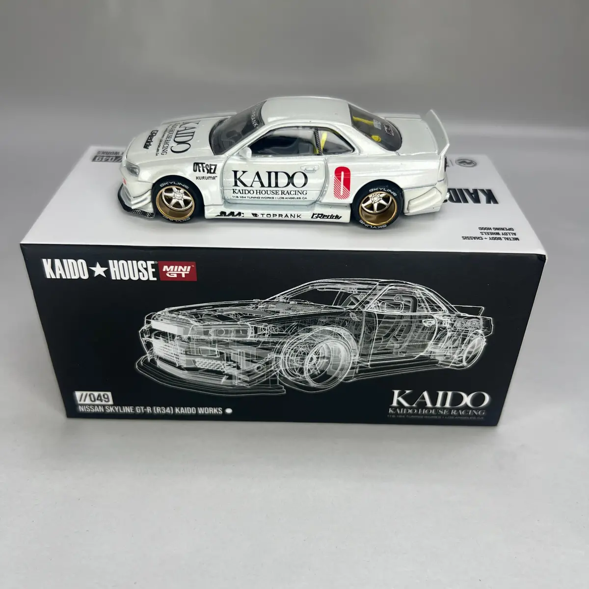 Chase Kaido House X Mini Gt 1:64 #049 Nissan Skyline Gt-R (R34) Kaido Works 1